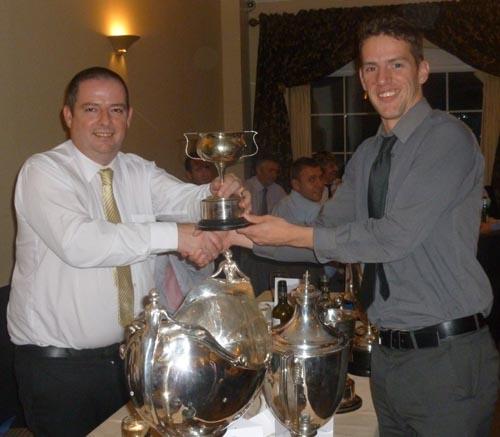 Brian presenting a trophy at a cricket dinner